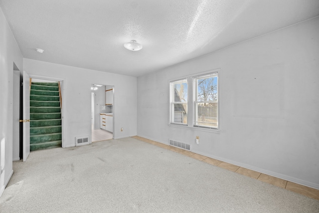 unfurnished bedroom featuring a textured ceiling