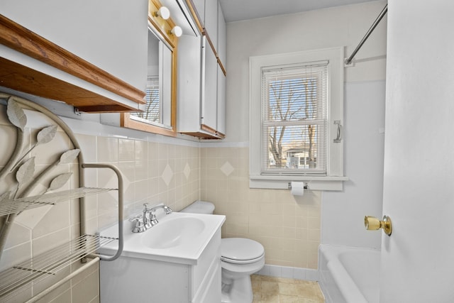 full bathroom with toilet, vanity, and shower / bathtub combination