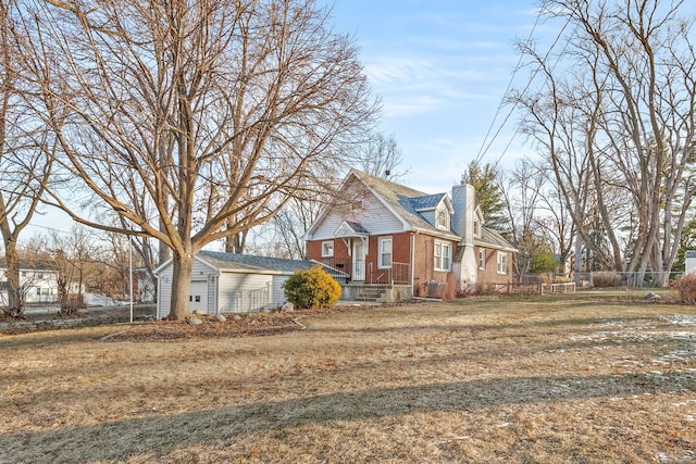 view of side of property featuring a yard