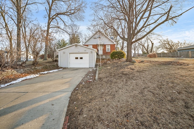 view of front of home featuring a garage and an outdoor structure