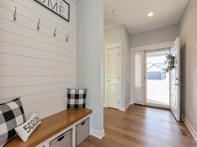 mudroom with light hardwood / wood-style floors