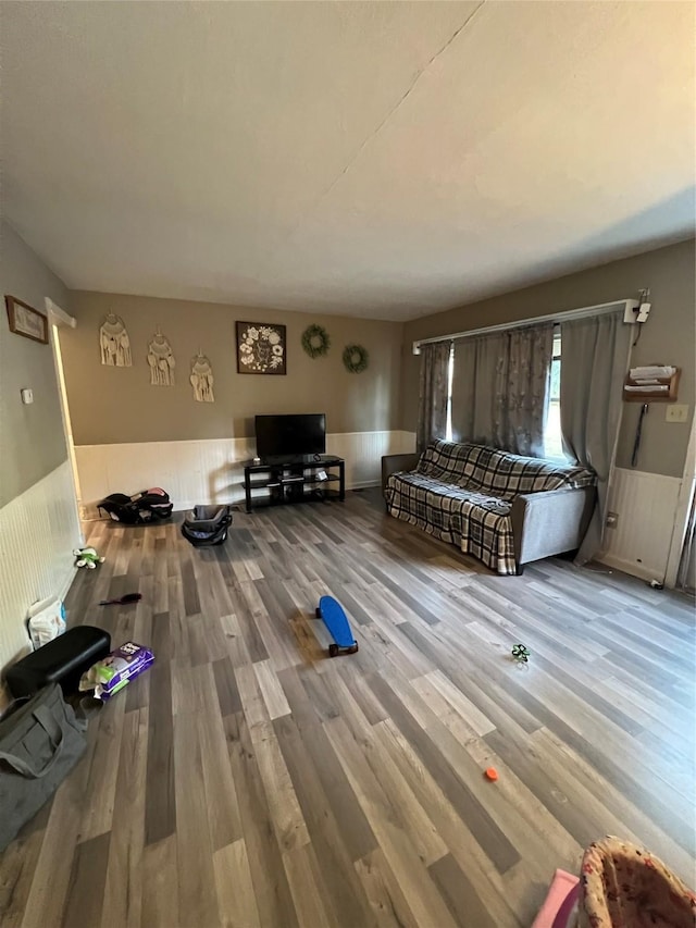 unfurnished living room featuring wood-type flooring