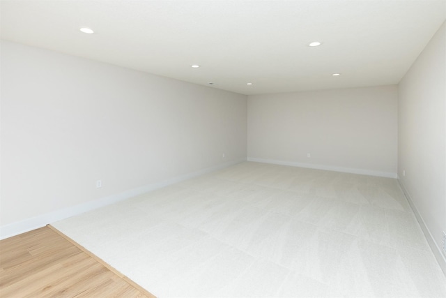 2390 Emma Ave, Des Moines, IA 50321 - empty room with recessed lighting and light carpet