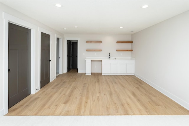 2390 Emma Ave, Des Moines, IA 50321 - unfurnished living room featuring recessed lighting and light wood-type flooring