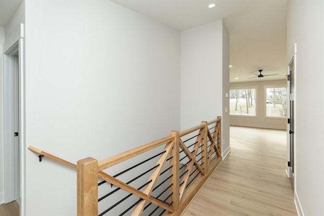 2390 Emma Ave, Des Moines, IA 50321 - corridor with an upstairs landing, light wood finished floors, and recessed lighting