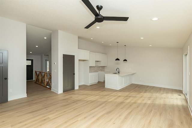 2390 Emma Ave, Des Moines, IA 50321 - unfurnished living room featuring ceiling fan, light wood finished floors, and recessed lighting