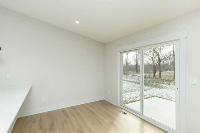 2390 Emma Ave, Des Moines, IA 50321 - unfurnished dining area featuring light wood-type flooring and recessed lighting