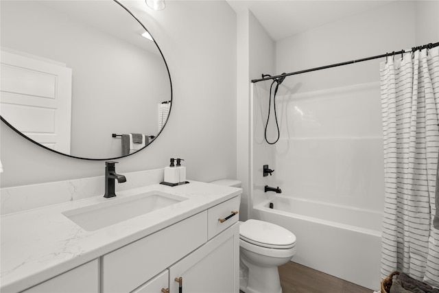 full bathroom with shower / bath combo with shower curtain, wood-type flooring, toilet, and vanity