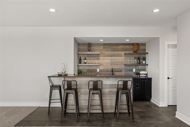 bar with wood walls and sink