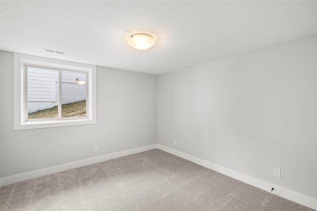 unfurnished room with carpet floors