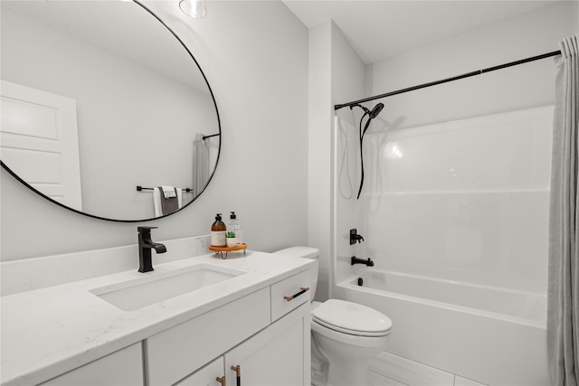 full bathroom featuring toilet, vanity, and washtub / shower combination