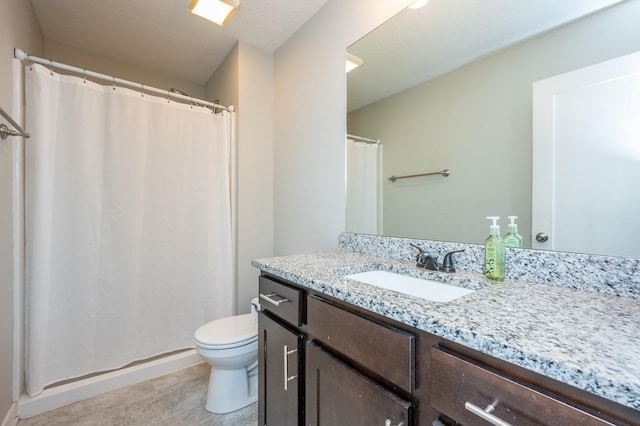 bathroom featuring toilet and vanity