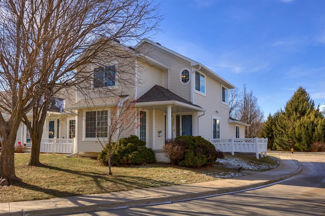 view of front facade with a porch and a front lawn