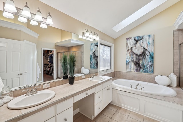 bathroom featuring plus walk in shower, tile patterned floors, lofted ceiling with skylight, and vanity