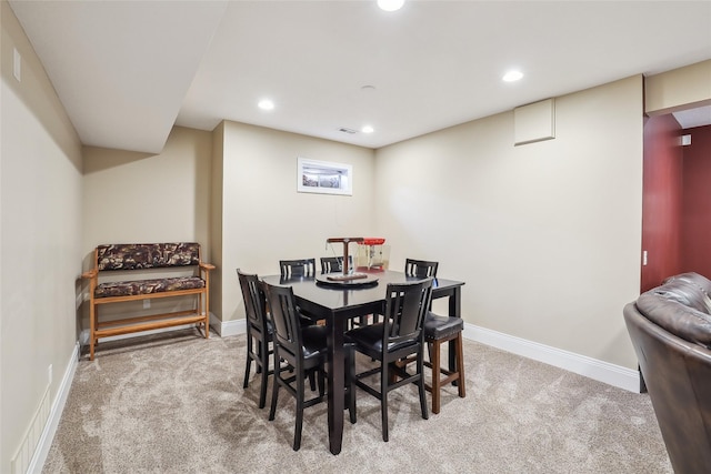 carpeted dining area with recessed lighting, baseboards, and visible vents