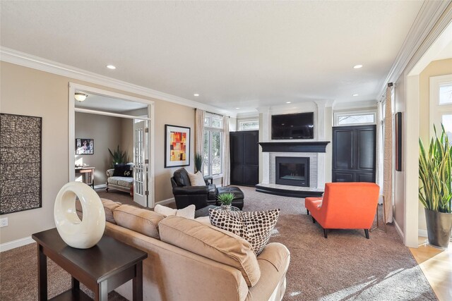 carpeted living room featuring ornamental molding