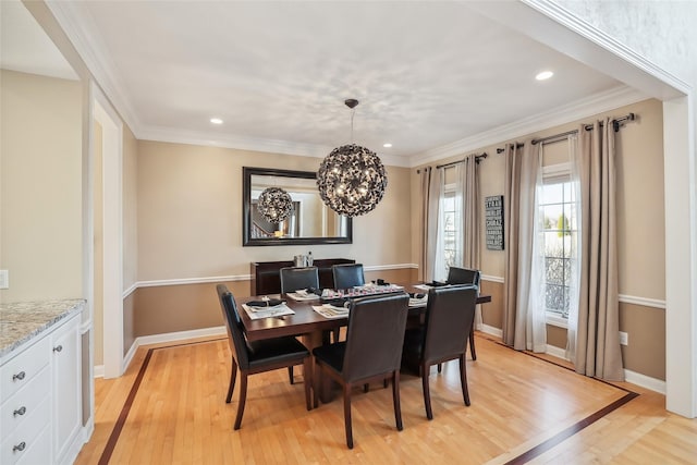 dining area with recessed lighting, baseboards, a notable chandelier, and light wood-style flooring