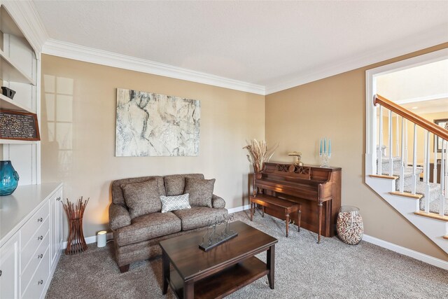 carpeted living area featuring crown molding, stairs, and baseboards