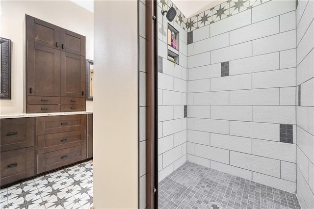 bathroom with tiled shower