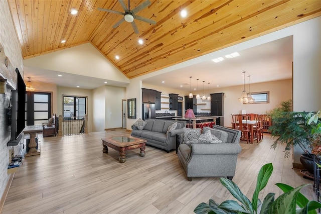 living room featuring light hardwood / wood-style floors, ceiling fan, high vaulted ceiling, and wood ceiling