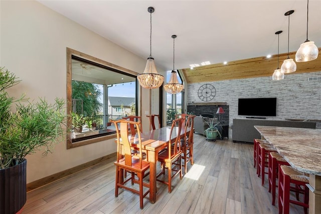 dining room featuring light hardwood / wood-style flooring and a notable chandelier