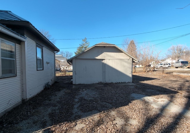 view of side of home with an outbuilding