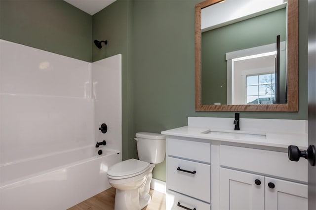 full bathroom with toilet, vanity, shower / tub combination, and hardwood / wood-style floors