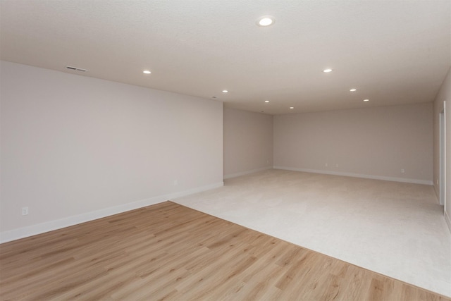 unfurnished room with light hardwood / wood-style floors