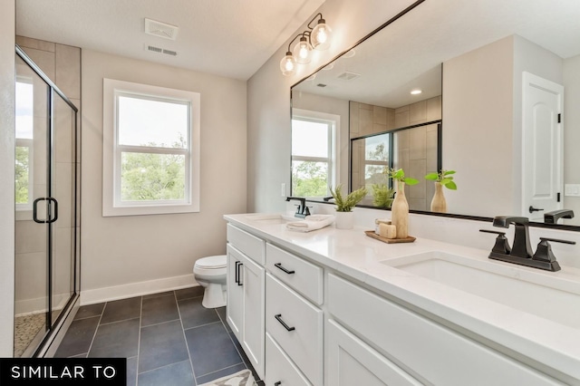 bathroom with plenty of natural light, toilet, walk in shower, and vanity