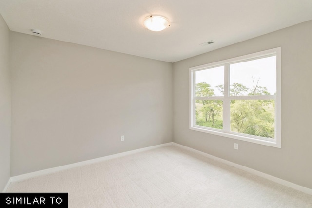 unfurnished room featuring carpet floors