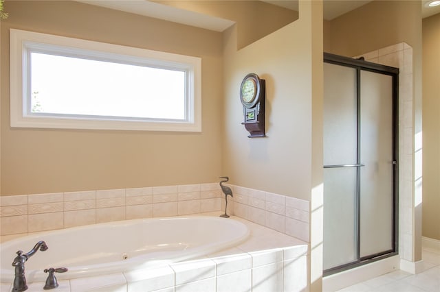 bathroom featuring separate shower and tub and tile patterned flooring