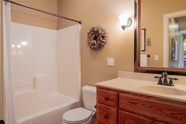 full bathroom featuring toilet, vanity, and bathing tub / shower combination