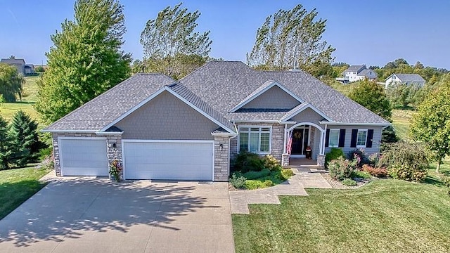 craftsman house featuring a garage and a front lawn