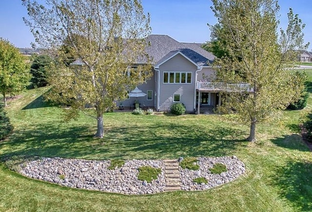 exterior space with a deck and a front yard