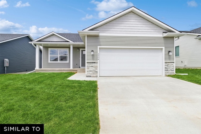 view of front of home featuring a garage and a front lawn