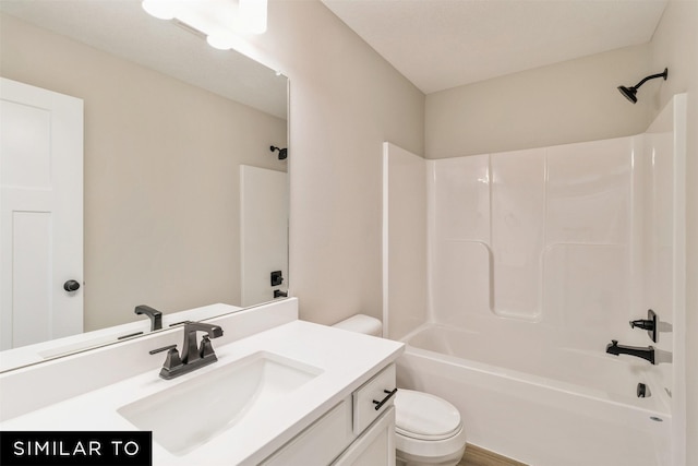 full bathroom with toilet, vanity, and tub / shower combination