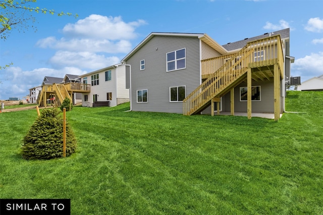 back of house with a patio area, a deck, central AC unit, and a lawn