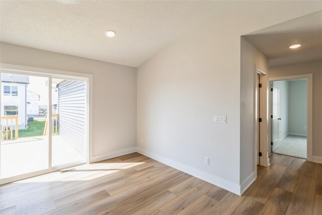 4207 NE 3rd St, Ankeny, IA 50021 - unfurnished room featuring baseboards, wood finished floors, and recessed lighting