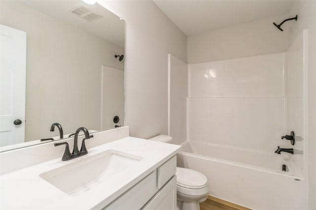 4207 NE 3rd St, Ankeny, IA 50021 - bathroom featuring toilet, visible vents, shower / washtub combination, wood finished floors, and vanity