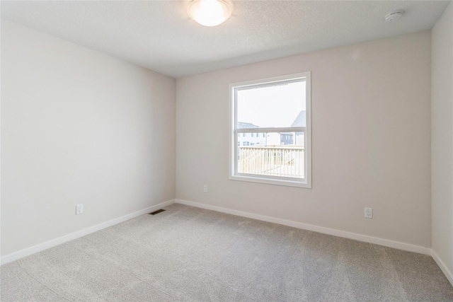 4207 NE 3rd St, Ankeny, IA 50021 - carpeted empty room with baseboards and visible vents