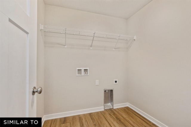 washroom featuring hardwood / wood-style flooring, washer hookup, and electric dryer hookup