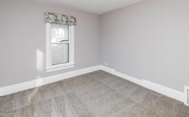 spare room featuring carpet