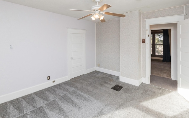 carpeted empty room with ceiling fan