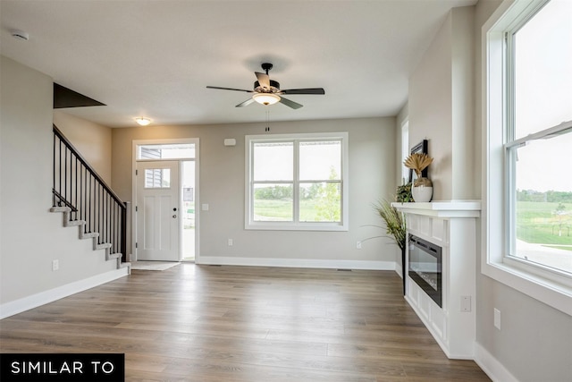 entryway featuring ceiling fan and wood-type flooring