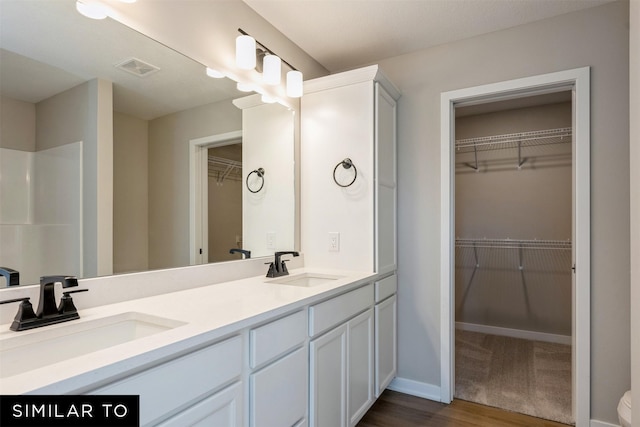 bathroom featuring vanity and hardwood / wood-style flooring