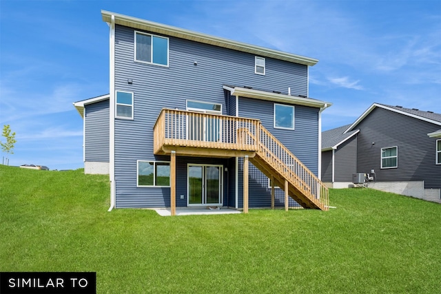 back of property with a wooden deck, cooling unit, a lawn, and a patio