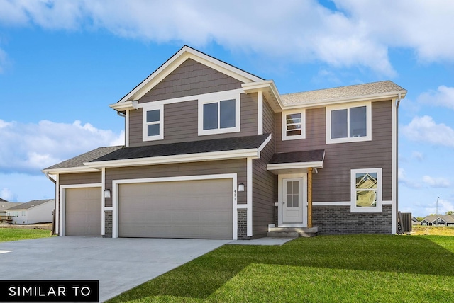 view of front of home with a front yard, a garage, and central AC