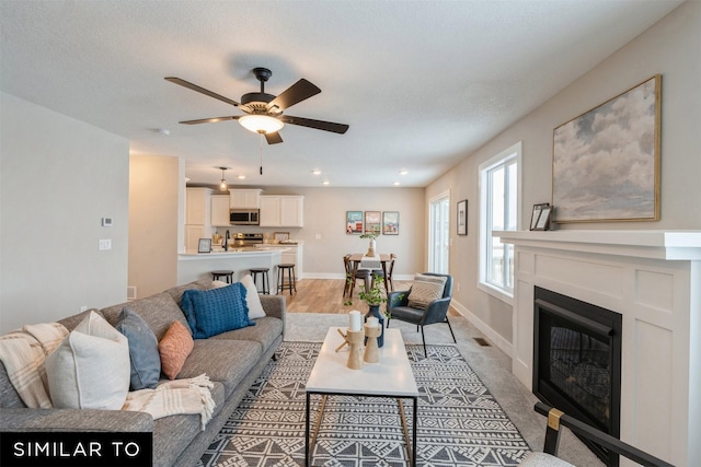 living room with ceiling fan