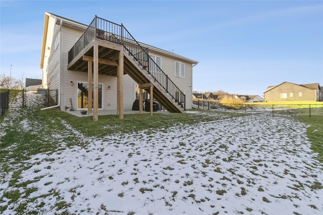 snow covered property with a yard