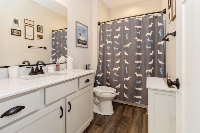 bathroom featuring hardwood / wood-style floors, toilet, and vanity